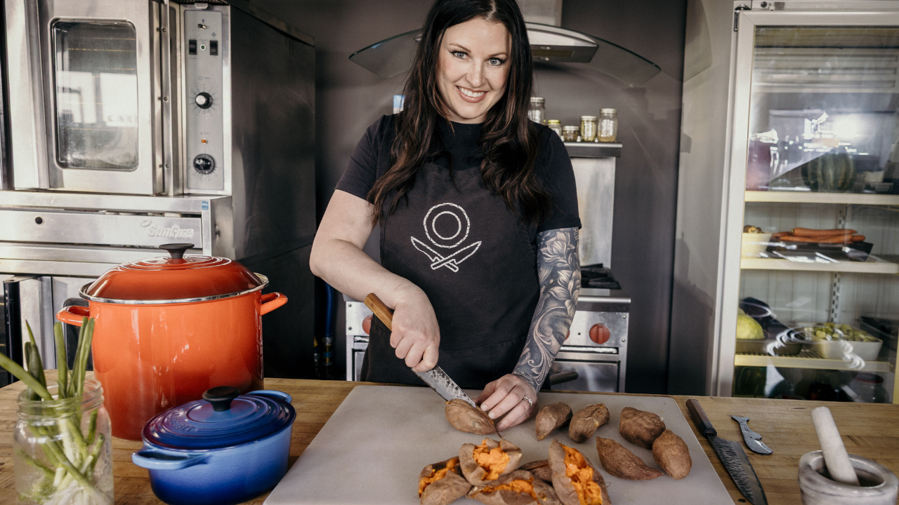 caterer preps food in the kitchen during a brand photography session